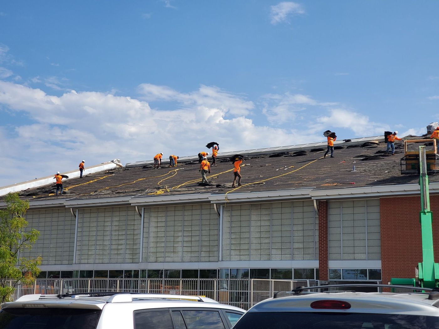 Revolve Construction crews re-roofing a commercial building in St. Louis