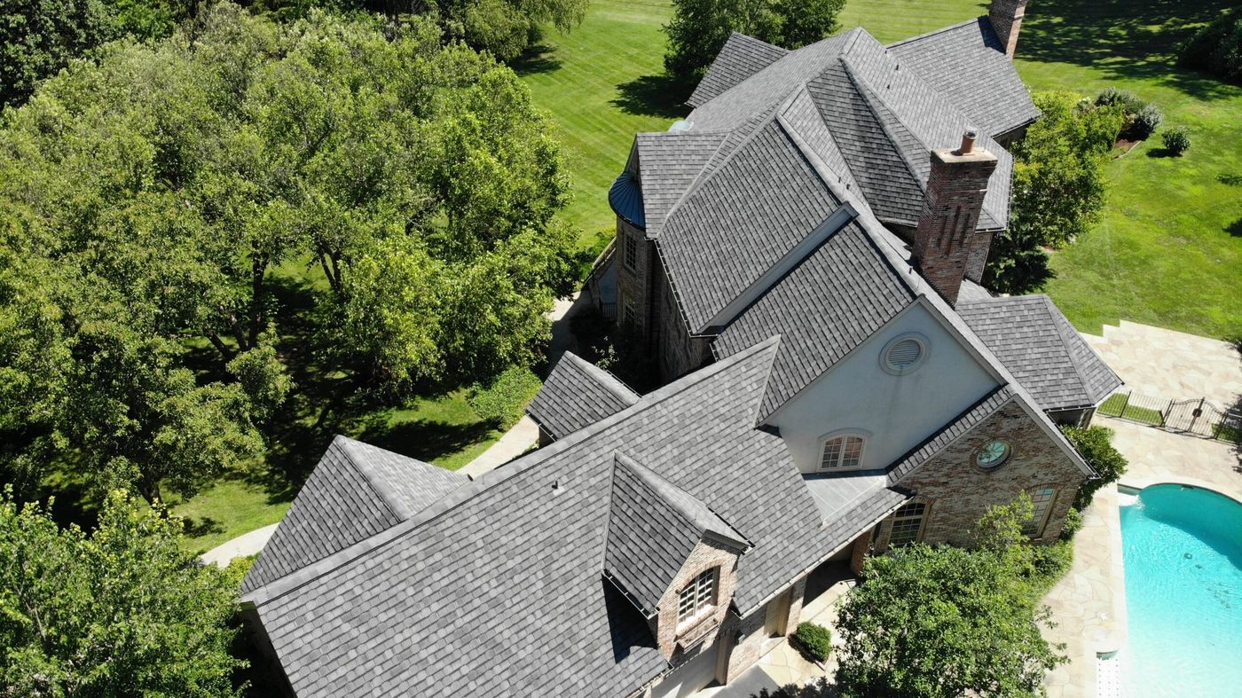 Aerial view of a completed residential roof replacement on a St. Louis home